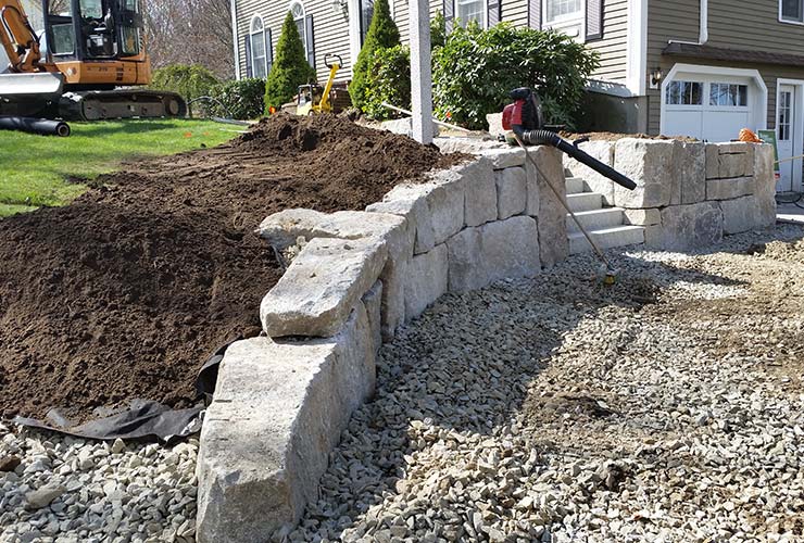 Completed natural stone retaining wall and steps.
